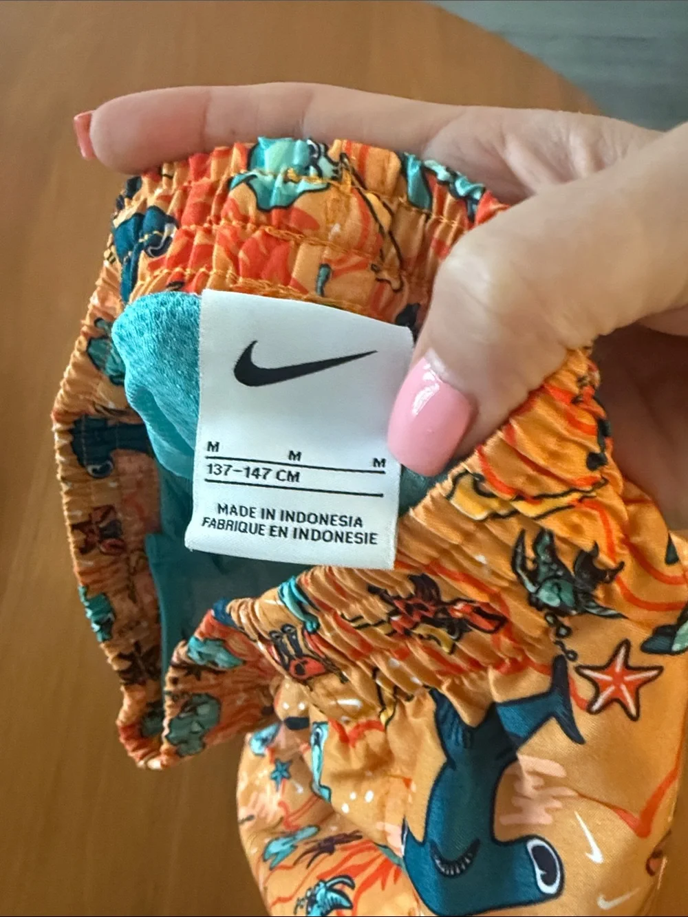 Nike Orange Swim Trunks with Blue Sea Creature Print. 7inch lined